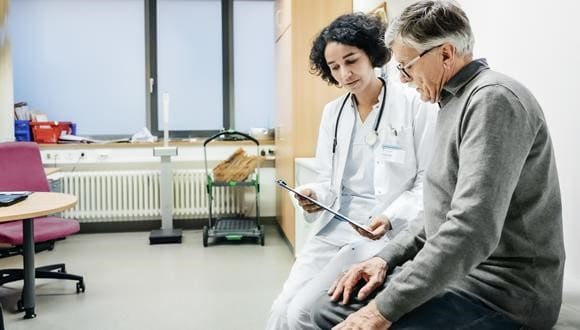 A man talking to a doctor
